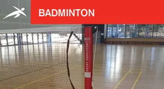 Indoor badminton court with wooden flooring, a red post, and net in the foreground. A red banner at the top reads “BADMINTON” with HiTech’s logo.