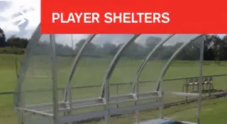 Transparent, curved player shelter with bench seating on a grassy sportsfield. A red banner at the top reads “PLAYER SHELTERS” with HiTech’s logo.