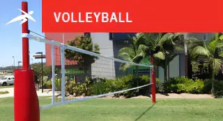 Outdoor grass volleyball setup with red posts and netting. A red banner at the top reads “VOLLEYBALL” with HiTech’s logo.
